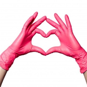 Hands in pink gloves